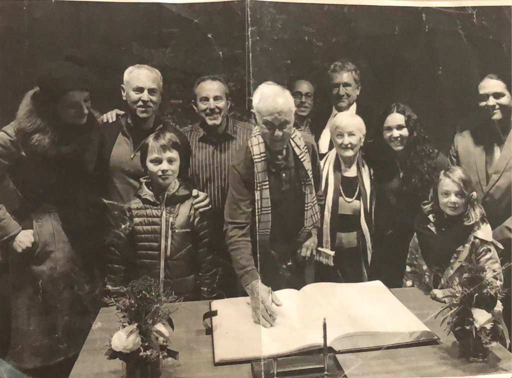 The Schindler family gathers around Max and Rose (centered) at an event in Cottbus, Germany.
